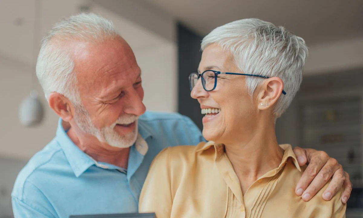 Happy Couple Smiling With All-On-4-Dental Implants