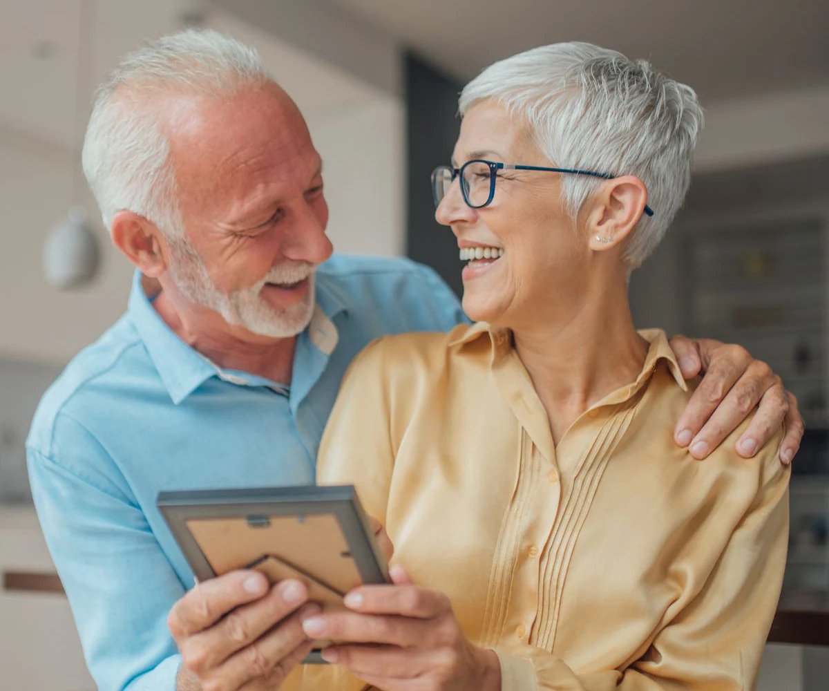 Happy Couple Smiling With All-On-4 Dental Implants