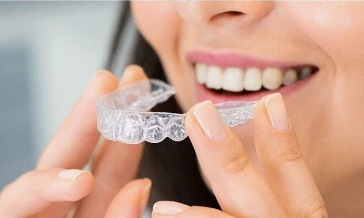 Woman With Invisalign Clear Aligner Tray