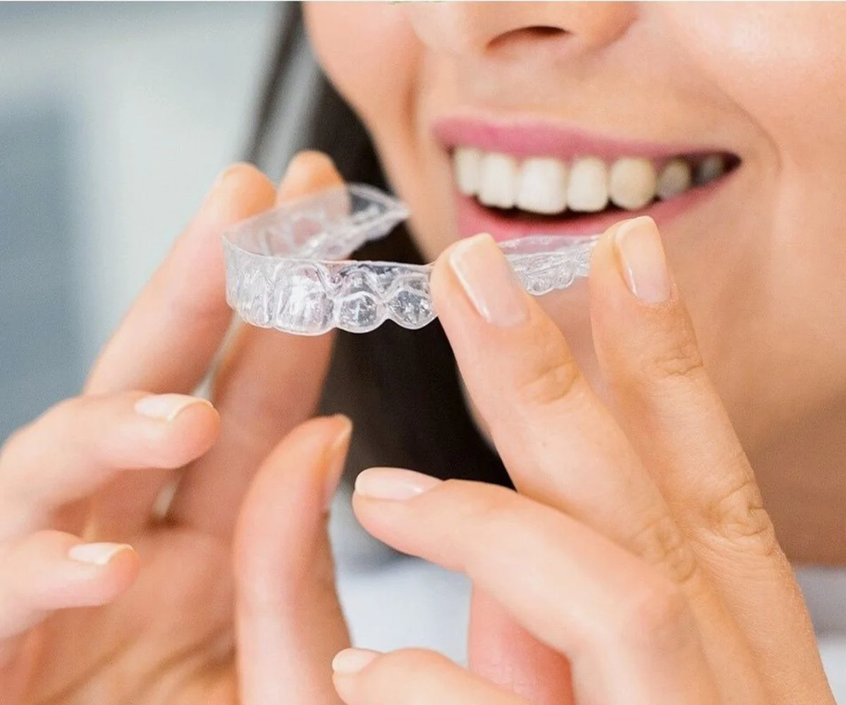 Woman With Invisalign Clear Aligner Tray