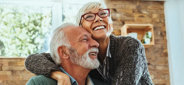Older Smiling Couple With Dental Implants