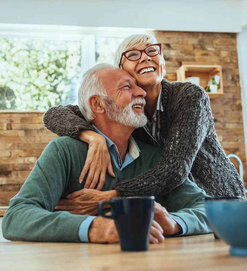Older Smiling Couple That Have Dental Implants