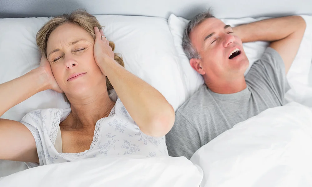 Woman Suffering From Husband Snoring