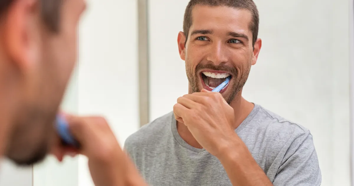 Man Practicing Brushing Teeth